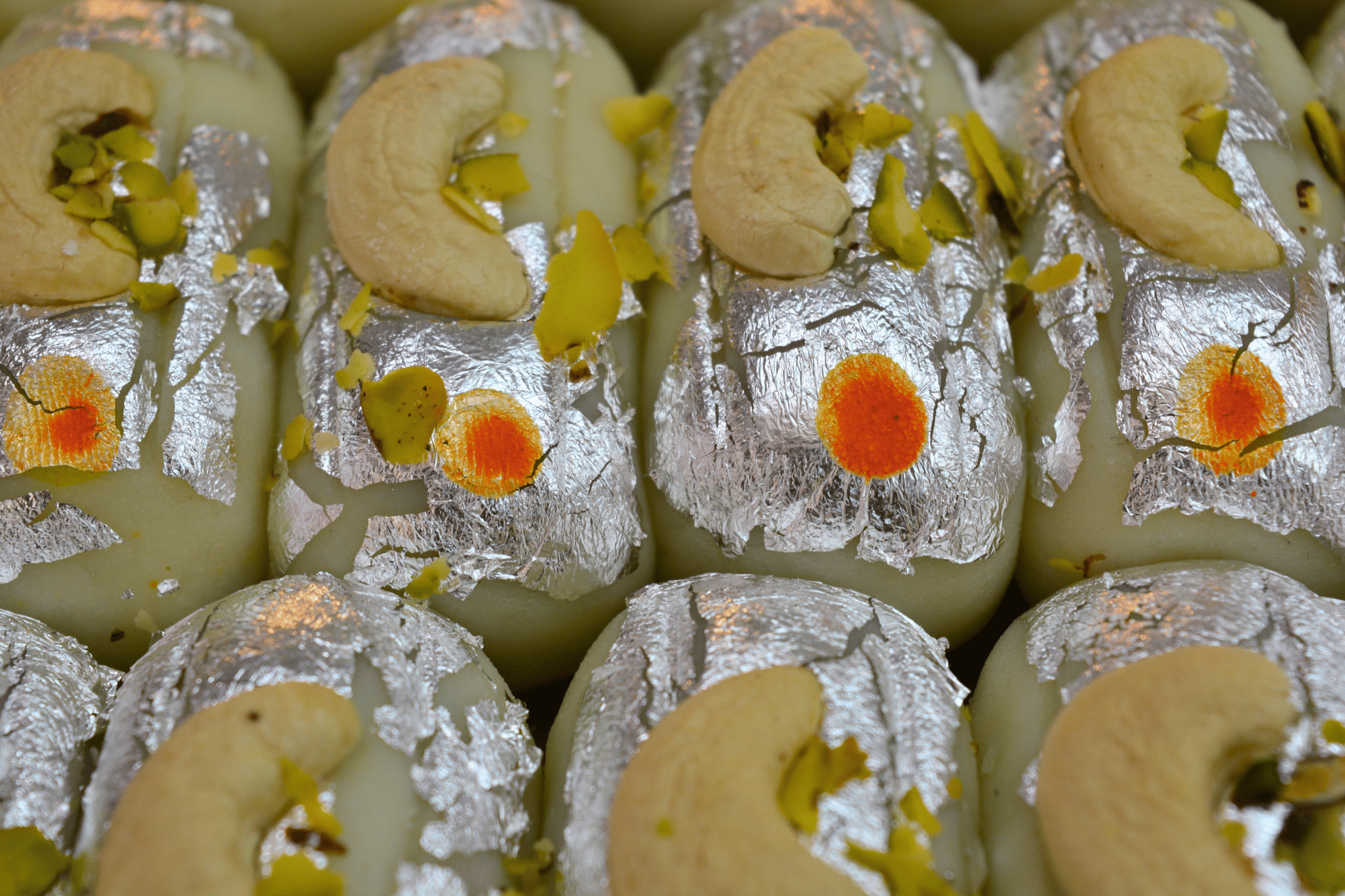 Silver-leafed kaju rolls.