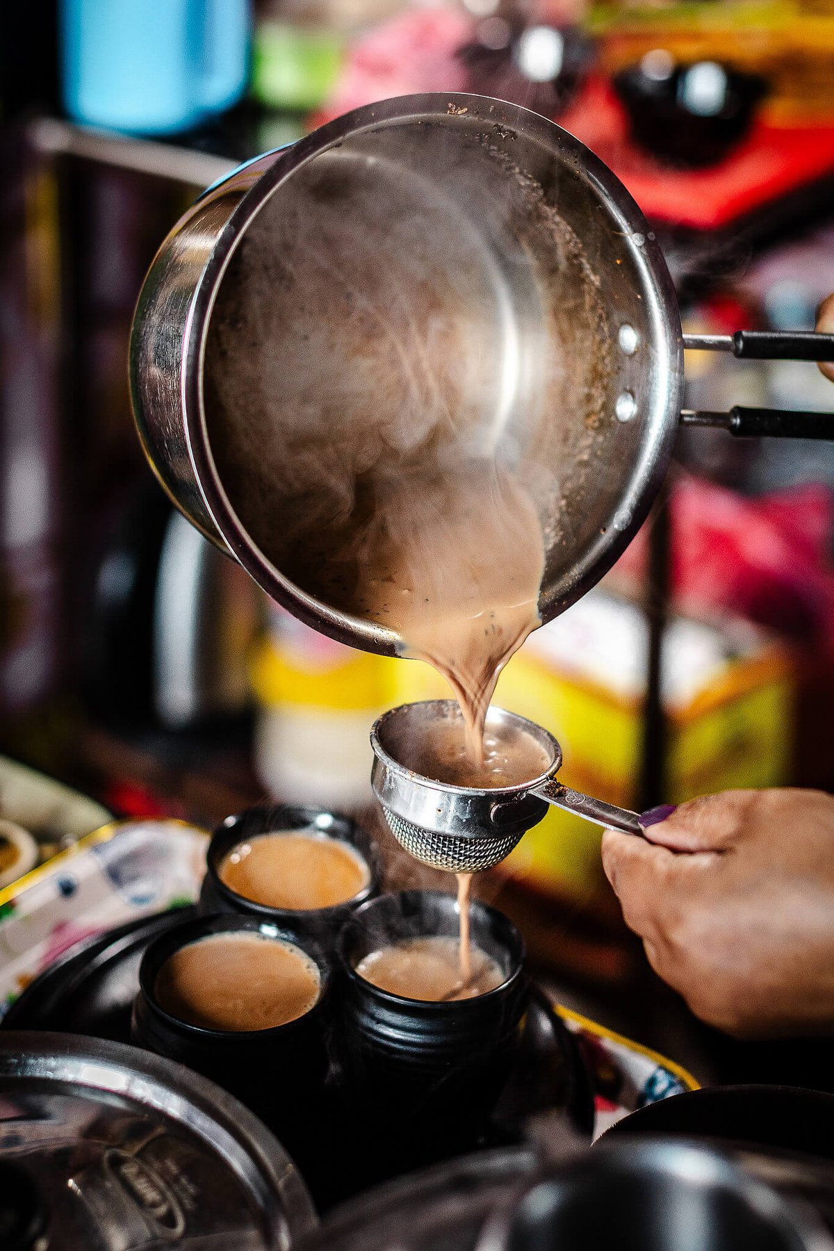 Pouring masala chai.
