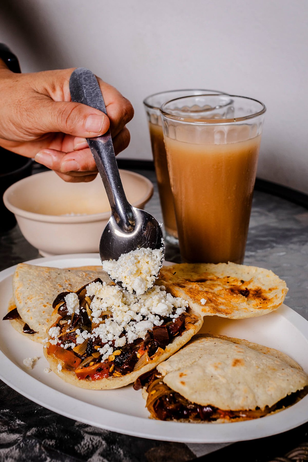 Queso over gorditas.