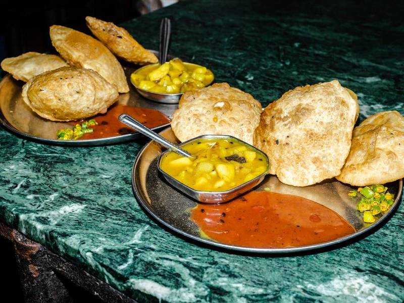 Puffed kachori and aloo dum.
