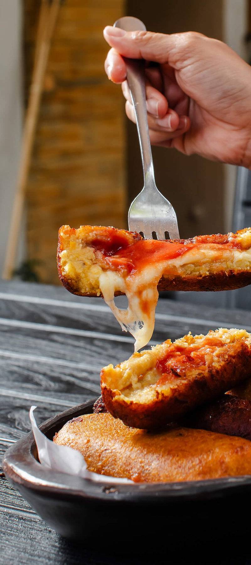 Arepa cheese pull.