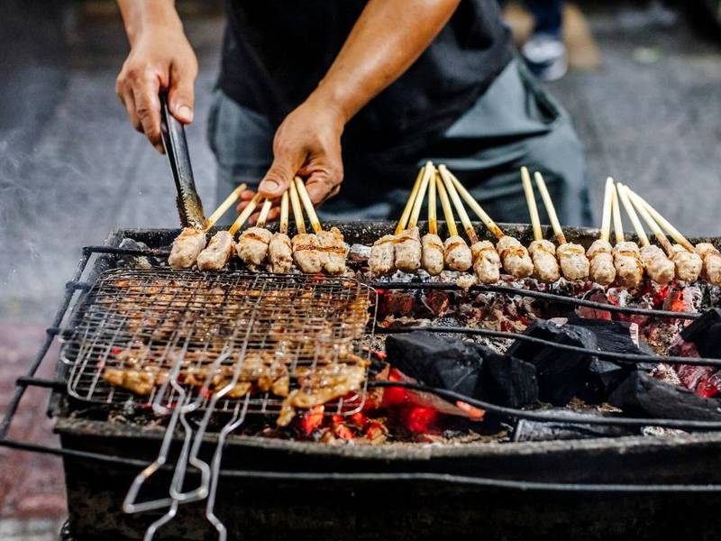 Cooking over charcoal.