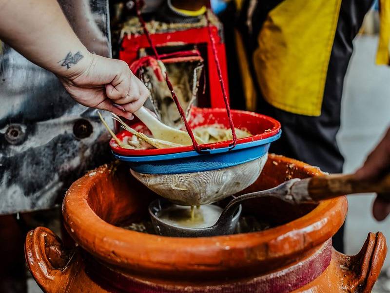 Straining agua panela.
