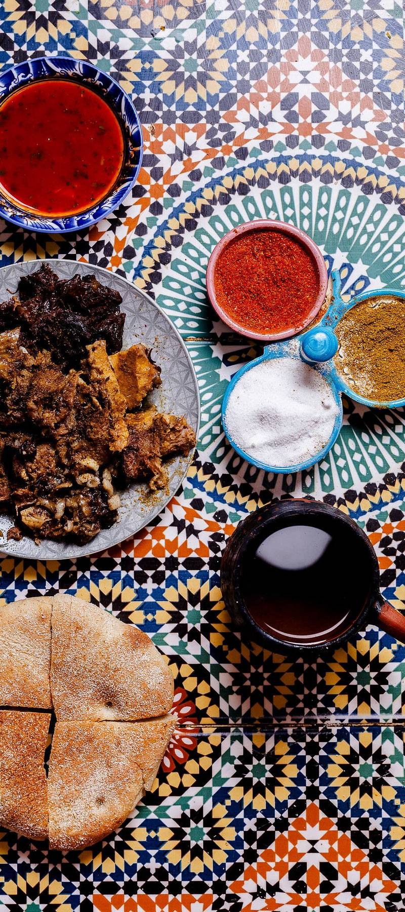 Steamed meat, khobz, cumin.