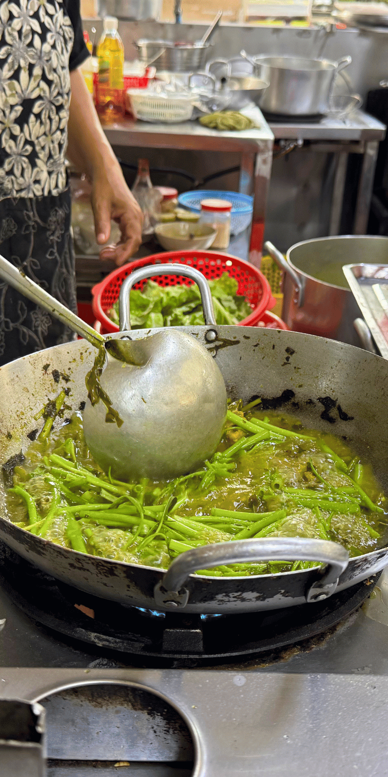 Stir-frying greens.