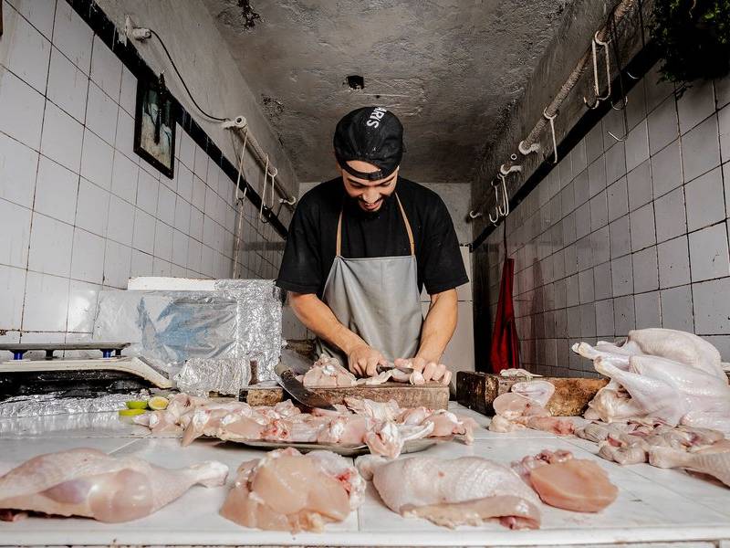 Chicken butcher at work.