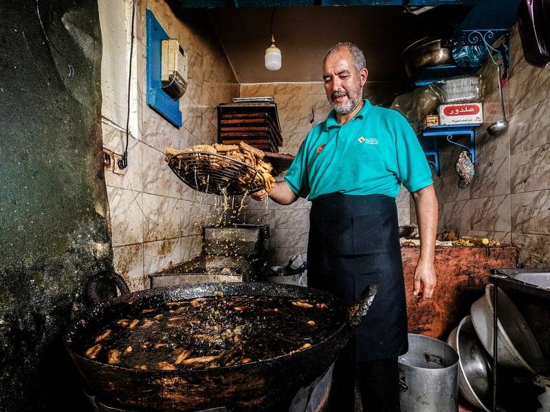 Frying small fish.