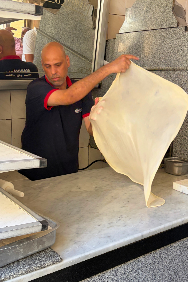 Slapping Hawawshi dough.