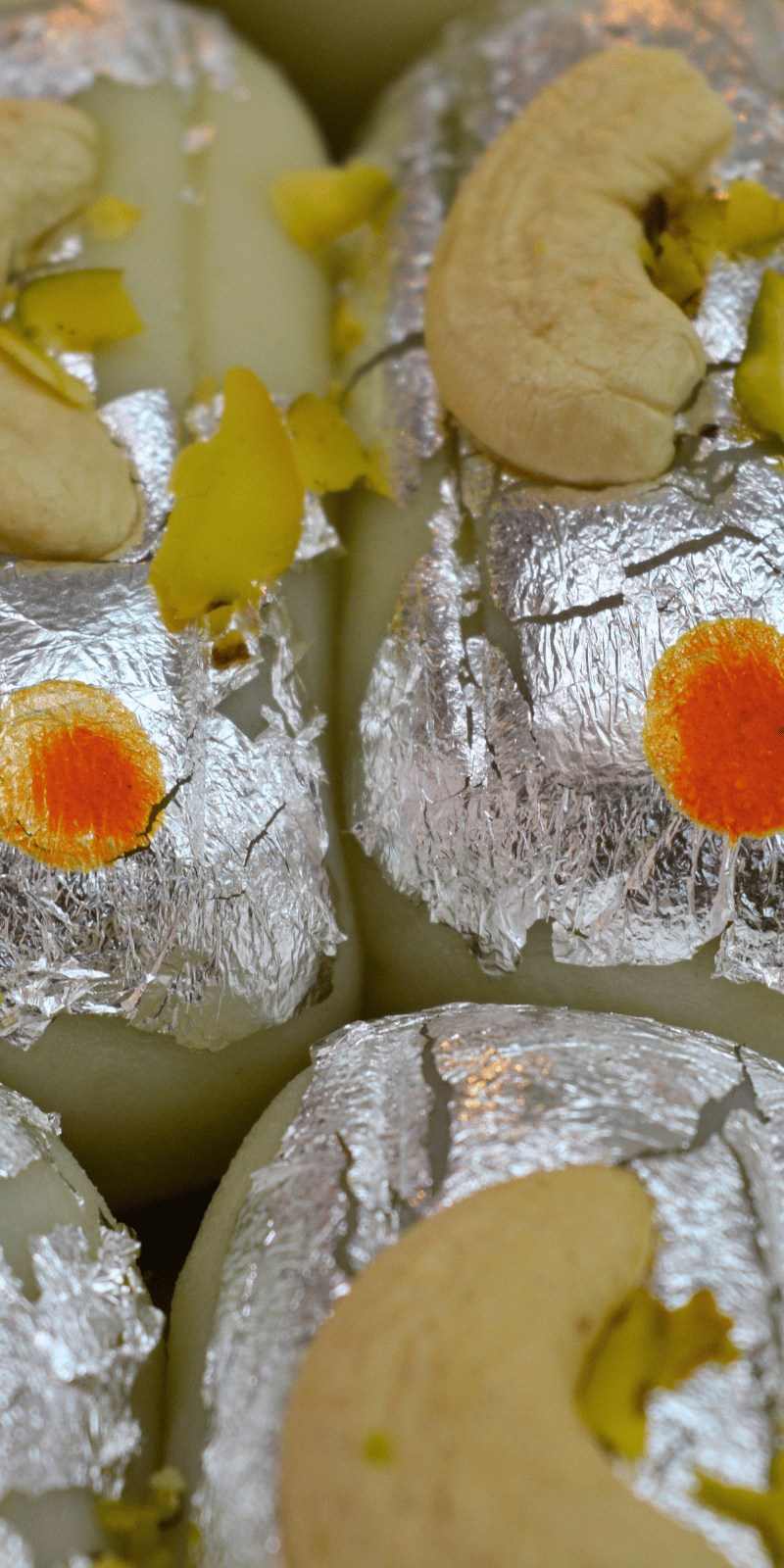 Silver-leafed kaju rolls.