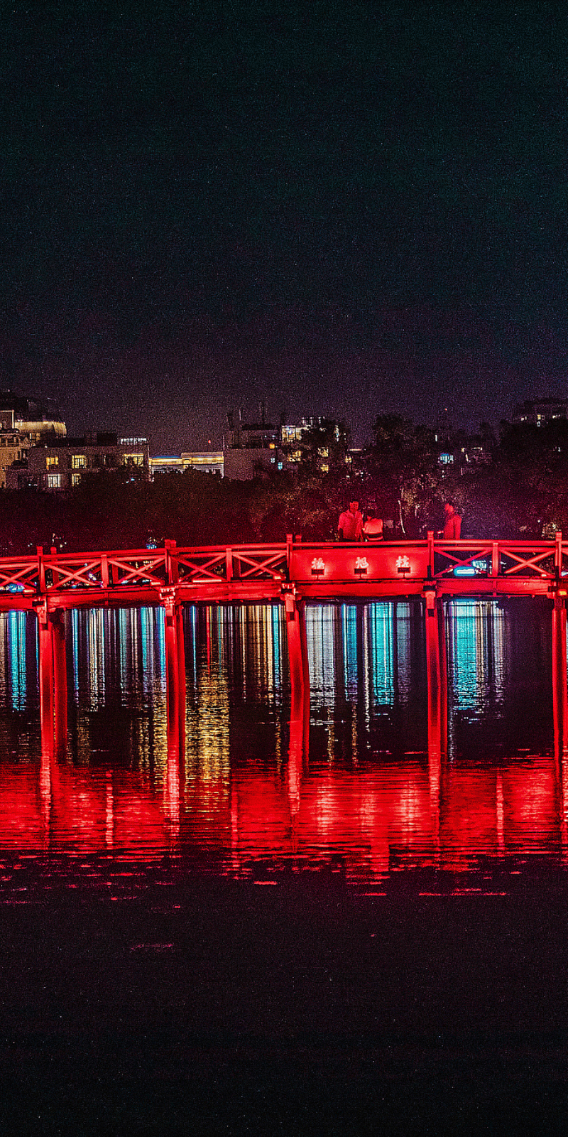 Cầu Thê Húc light at night.