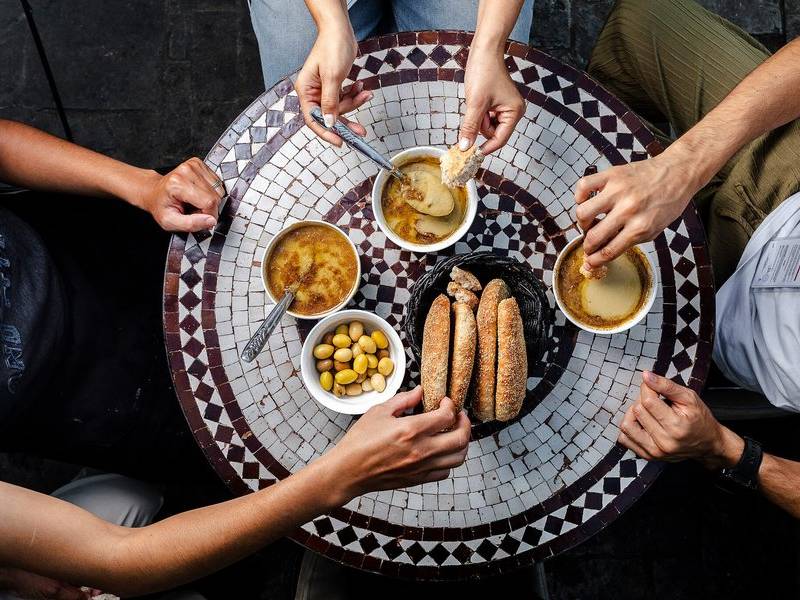 Bissara table, khobz and olives.