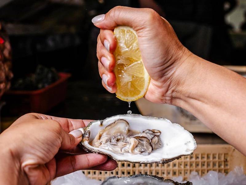 Lemon over oyster.