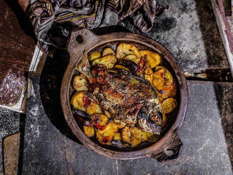 Wood fired fish with potatoes.
