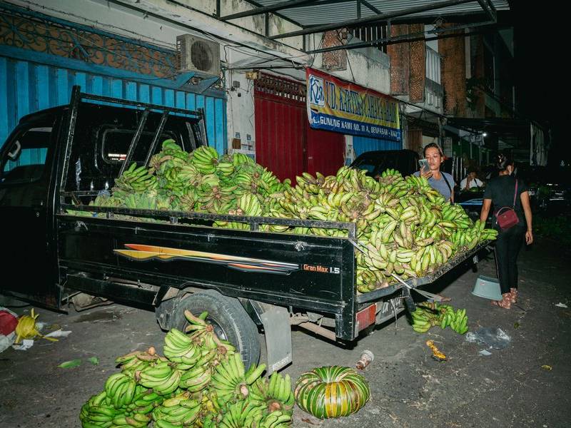 Pick up truck banana vendor.