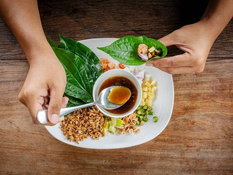 Leaf-wrapped miang kham.