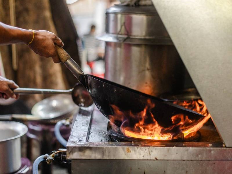 Wok on the roaring flame.