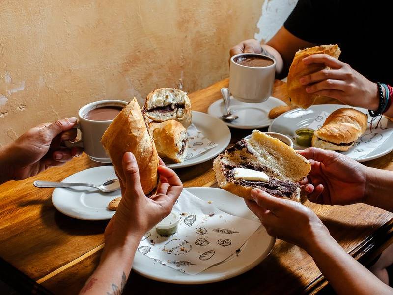 Sharing chocolate and bread.