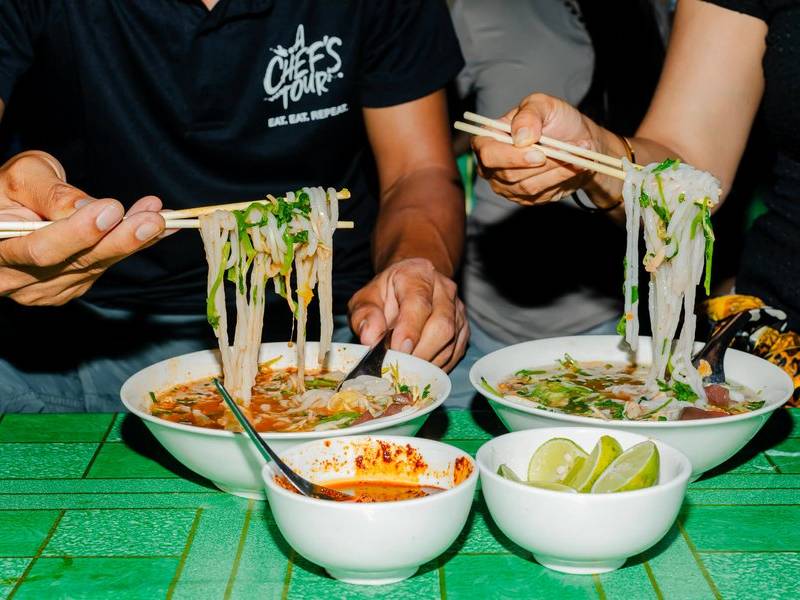 Slurping khao soi.