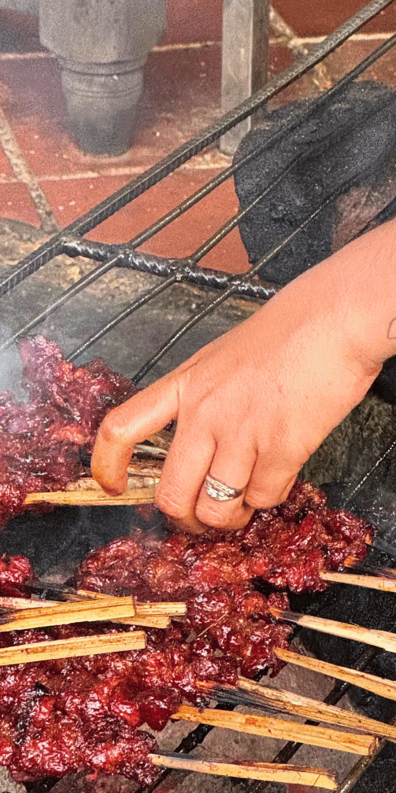 Marinated skewers grilling.
