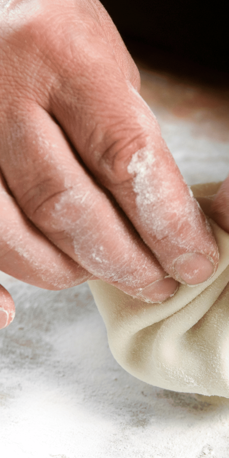 Pleating a khinkali.