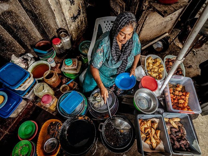 Aunty working the fryer.