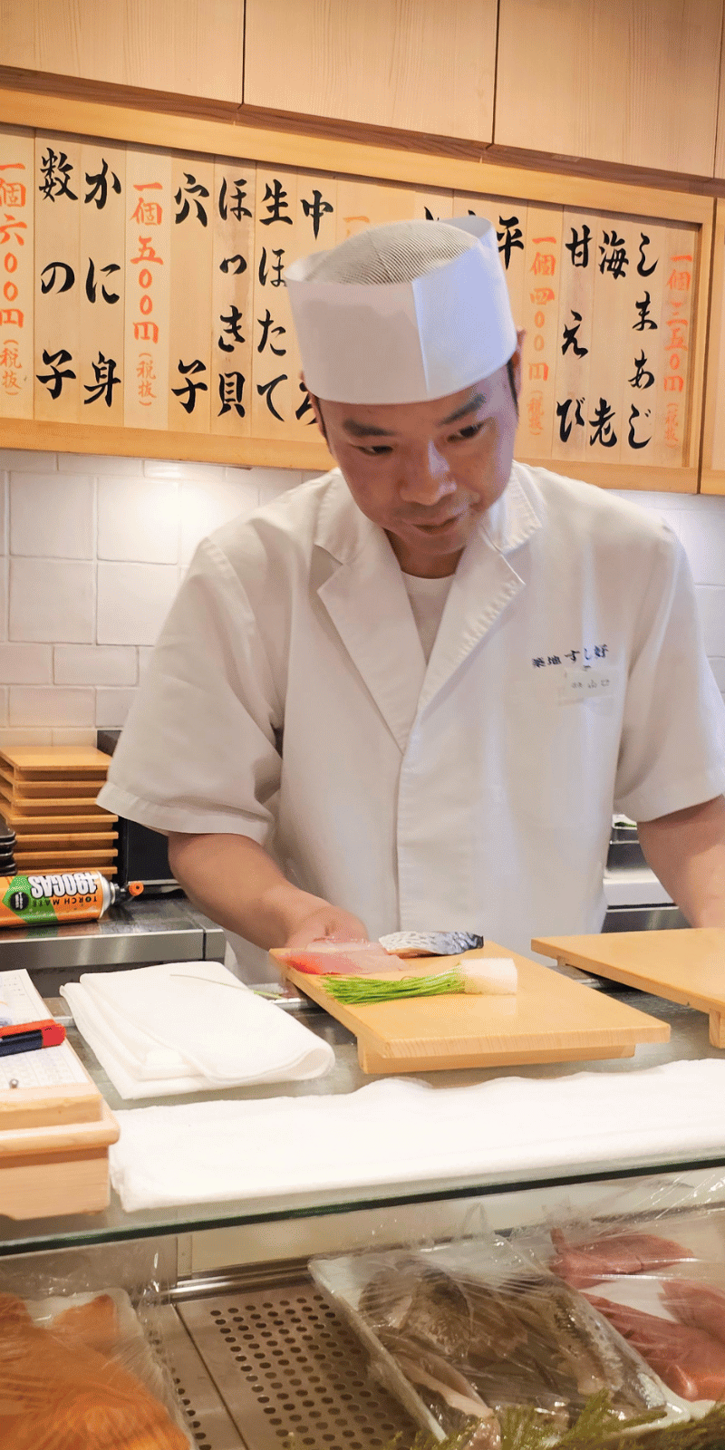 Sushi counter chef.