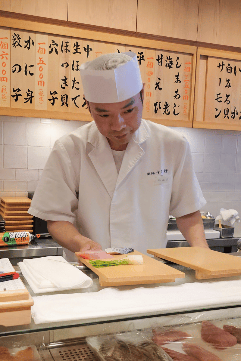 Sushi counter chef.