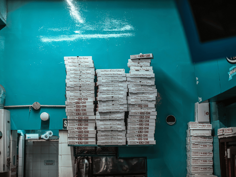 Stacked pizza boxes.