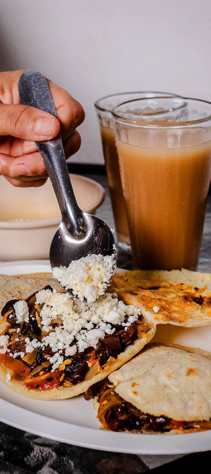 Queso over gorditas.
