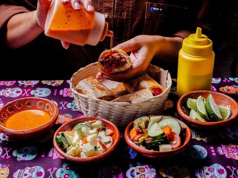 Burritos and salsa.