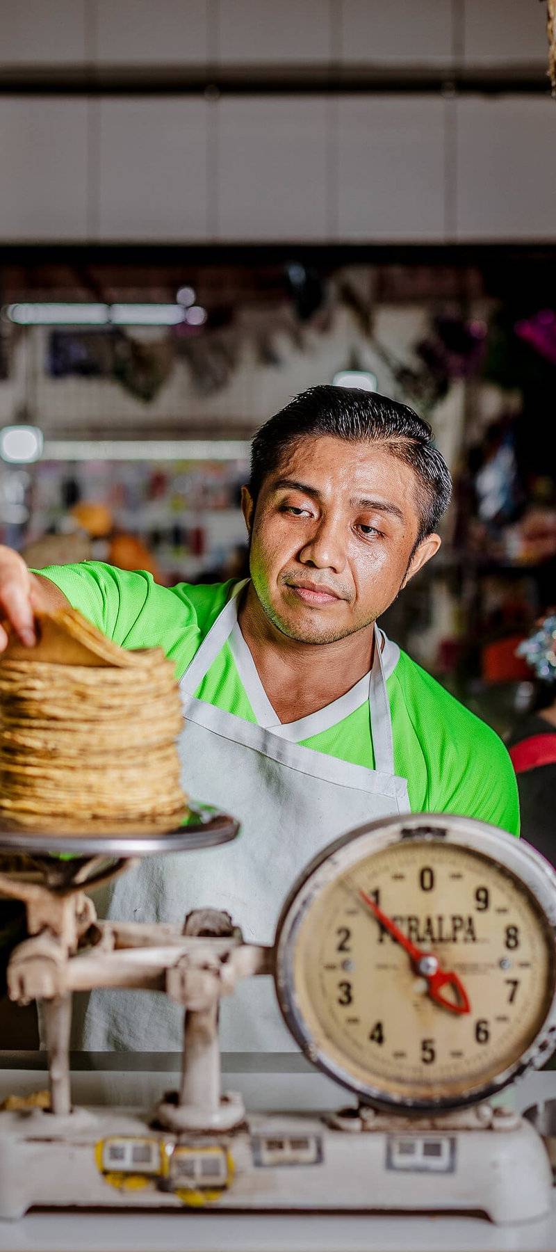 Weighing the tortillas.