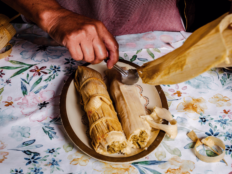 Unwrapping tamales.