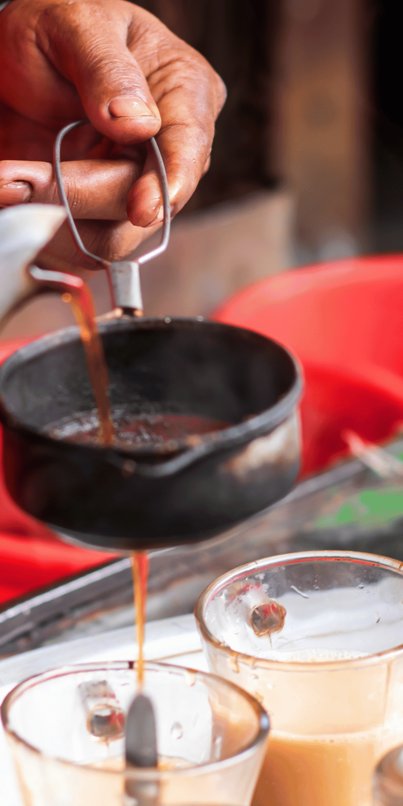 Pouring masala chai.