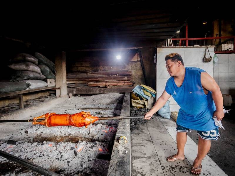 Tending the coals.