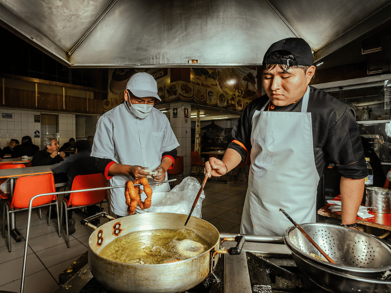 Frying buñuelos.
