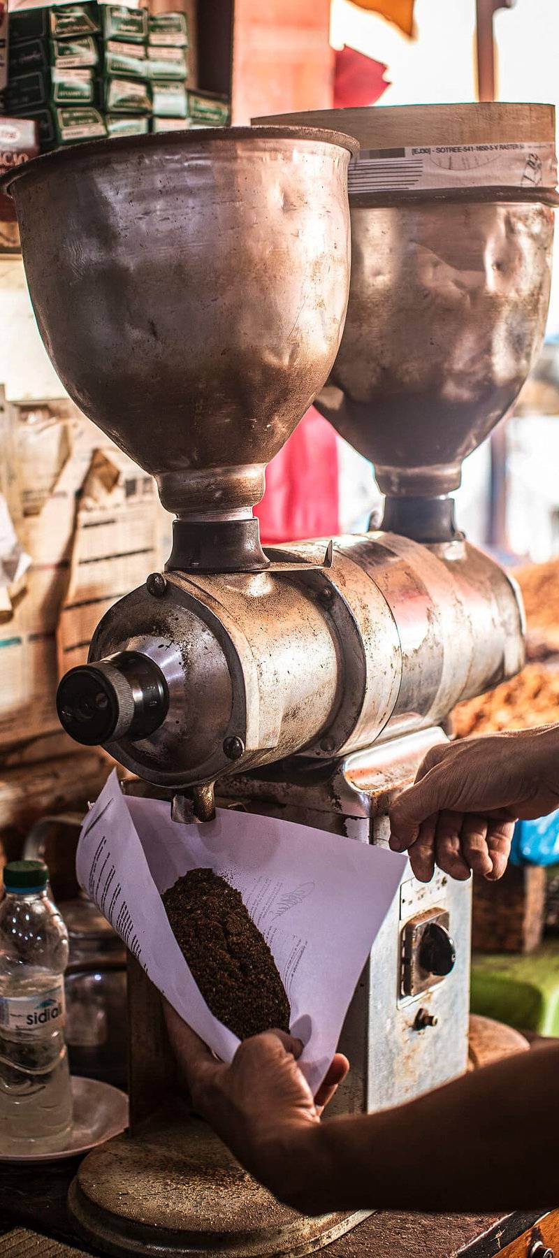 Grinding fresh coffee.