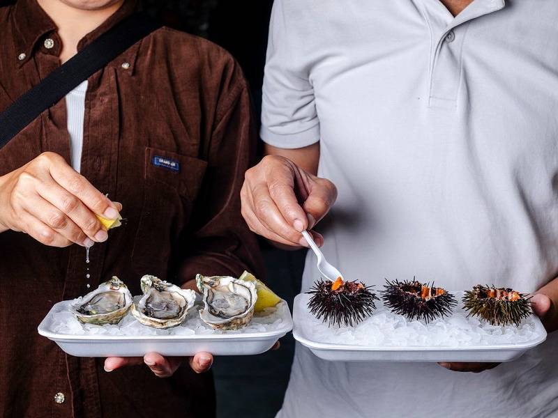 Shucks oysters and urchins.